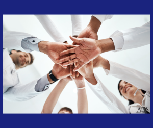doctors joining hands as a team gesture